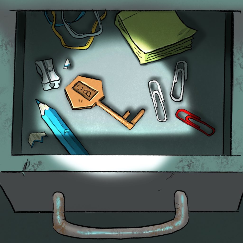 Inside the drawer are various office supplies and a gold key with a pentagonal bow which has a rectangular shape with the letters CB on it.